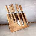 Light wood magnetic knife block with five included knives.