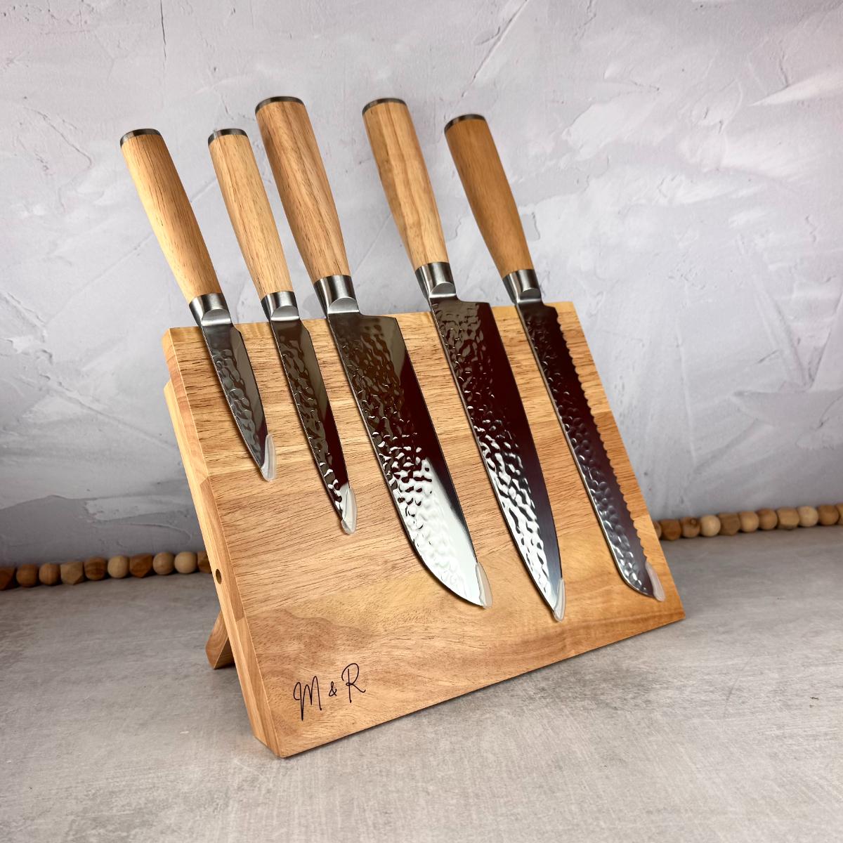 Light wood magnetic knife block with five included knives.