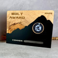 Plaque with hardwood back with rounded corners and metal plate in the shape of a mountain in front. 