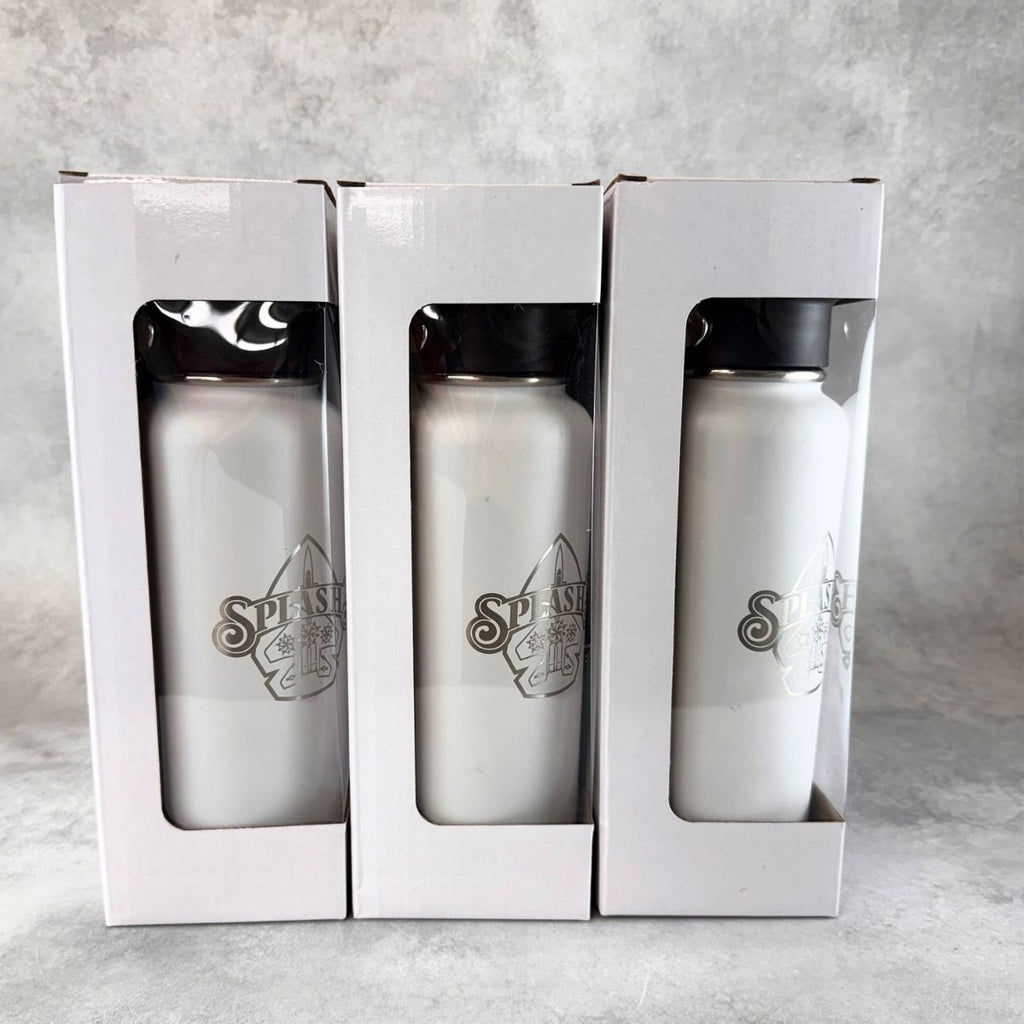 Three engraved white insulated water bottles with black lids displayed inside white retail boxes against a gray textured background.