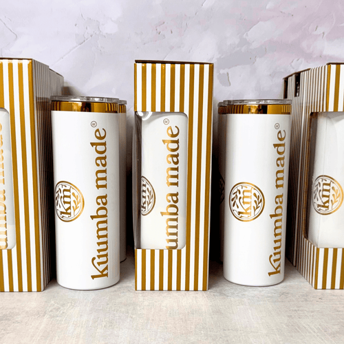 Skinny 20 oz tumbler with a custom engraved logo in a gold finish