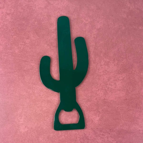 powder coated green saguaro shaped bottle opener on a rust colored background