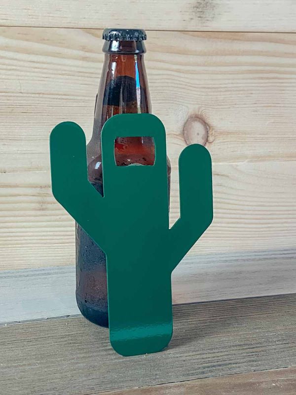 green saguaro cactus bottle opener leaning against bottle