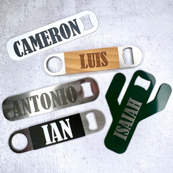 a variety of 5 bottle openers made and engraved by L4 Laser Engraving and Metal Art - white opener engraved with Cameron, wood and metal opener engraved with Luis, metal opener engraved with Antonio, silicone and metal opener engraved with Ian, and cactus opener engraved with Isiah.
