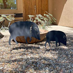 two metal plasma cut javelina, one large and one small