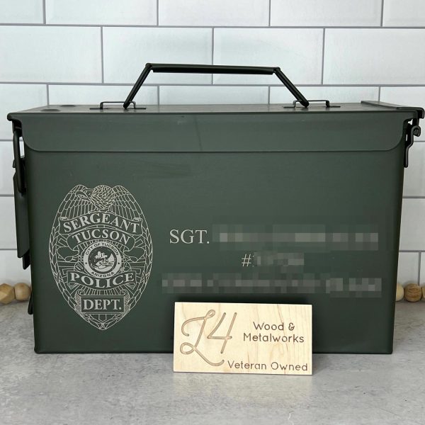 image of custom ammo box engraved with a Tucson Police shield and officer information.