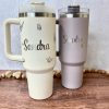 two engraved Stanley tumblers with name Sandra