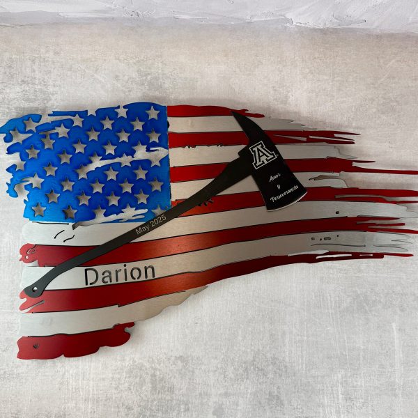 red, silver, and blue custom flag with name cut out and fireman's axe layered on top.