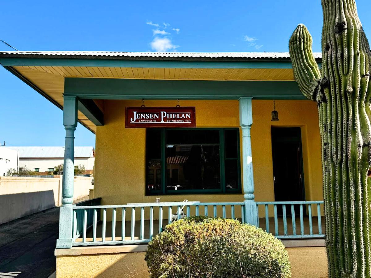 Metal sign hung for Jensen Phelan Law Firm in Tucson Arizona.