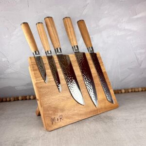 Light wood magnetic knife block with five included knives.